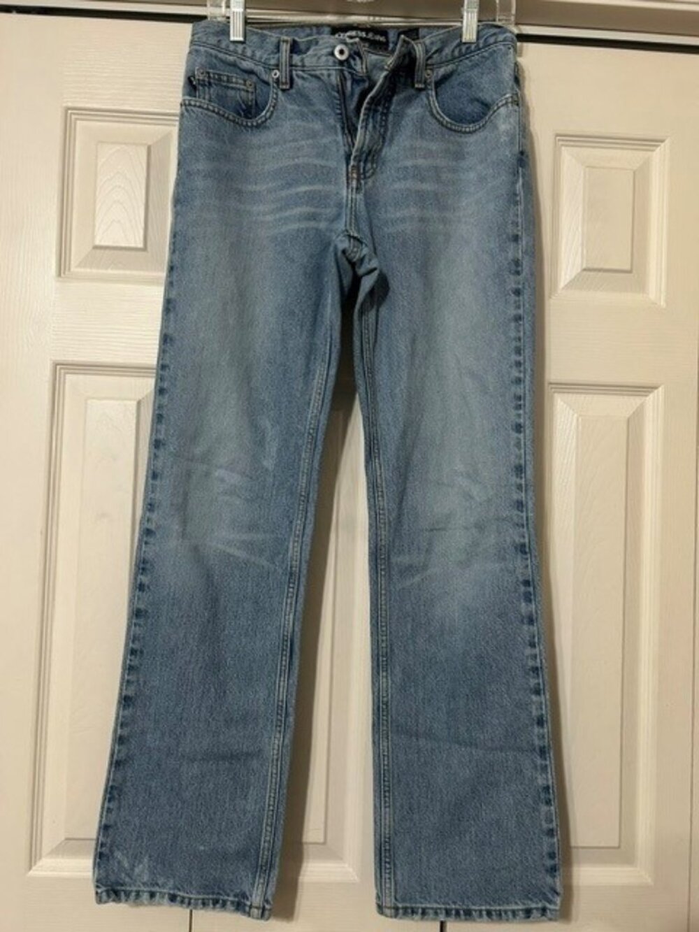 Express vintage light-wash bootcut denim jeans featuring a mid-rise waist. (5/6)